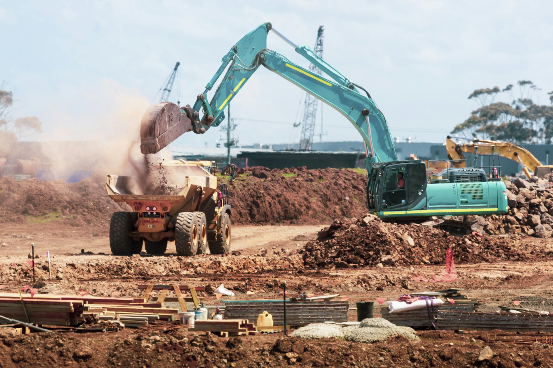 Construction machinery and equipment on a rugged project site — RuggedRent Machinery rental context